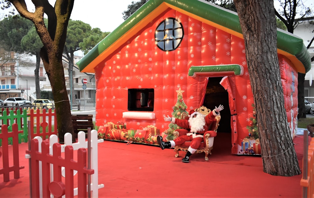 a large inflatable house with a santa clause in it