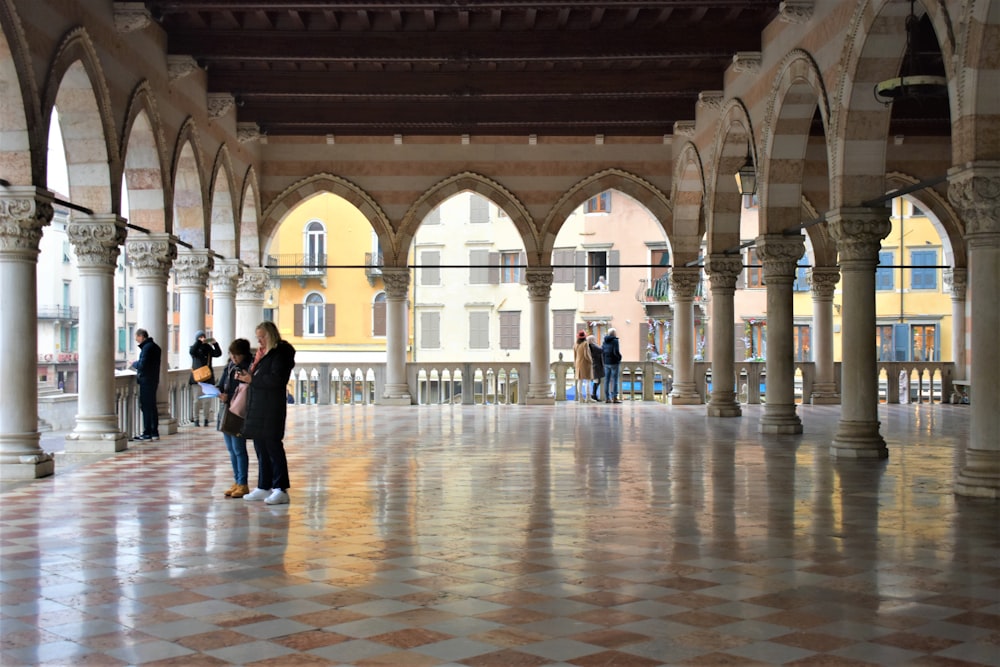 a couple of people that are standing in a building