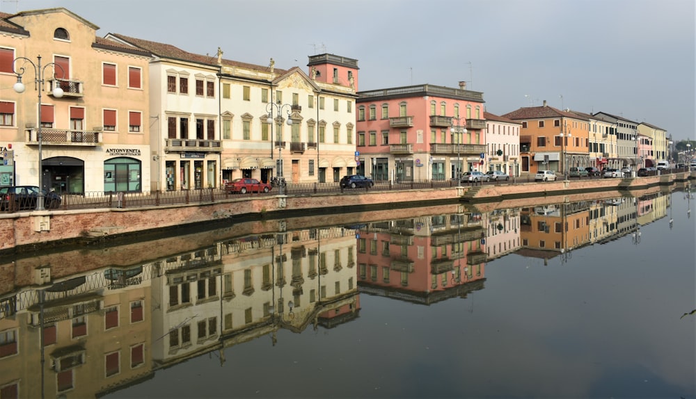 a river running through a city next to tall buildings