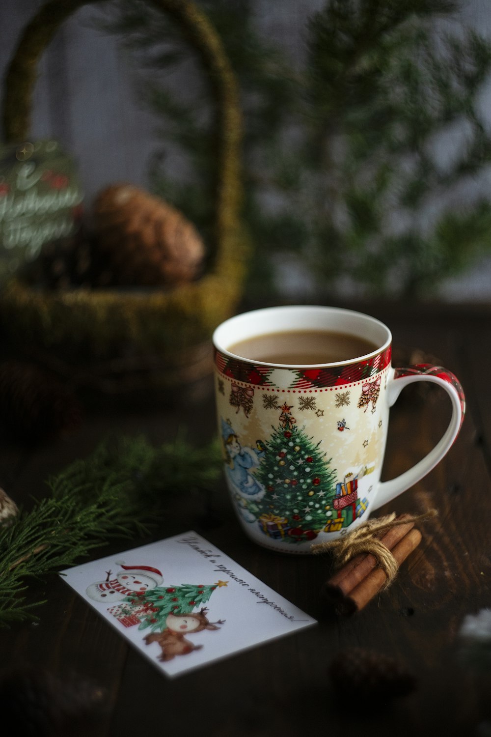 a cup of coffee sitting on top of a wooden table