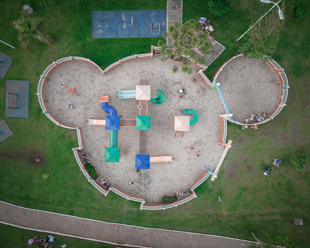 an aerial view of a park with a playground