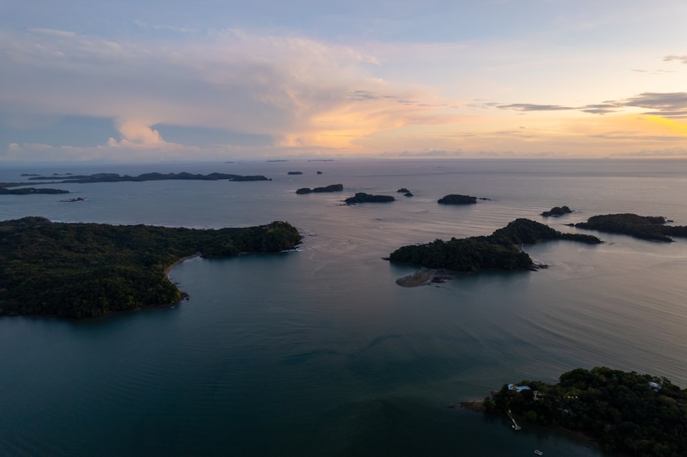 an aerial view of several small islands in the ocean