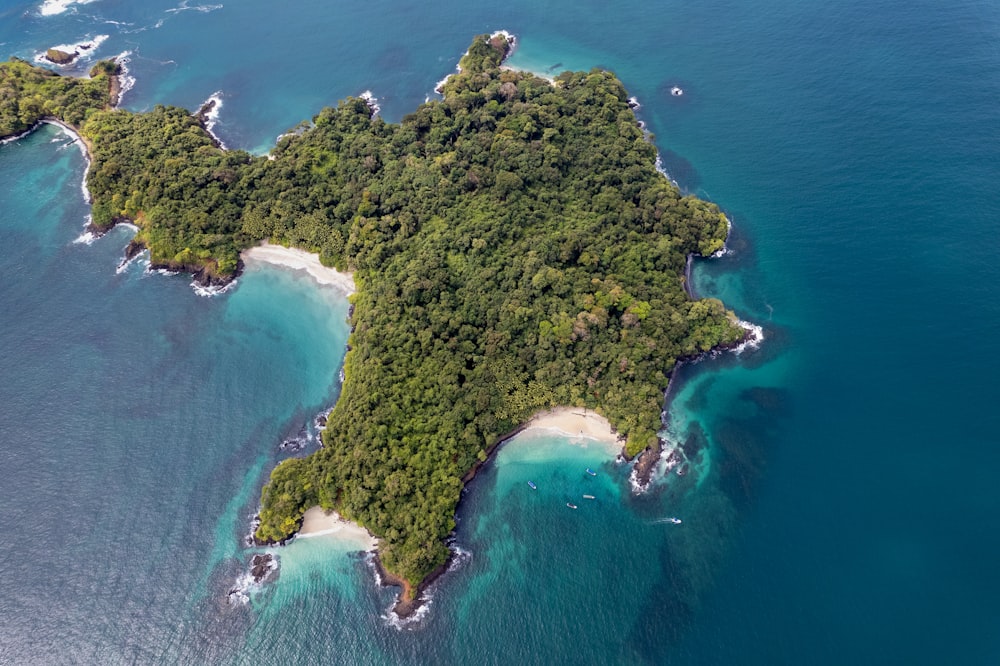 an aerial view of an island in the middle of the ocean