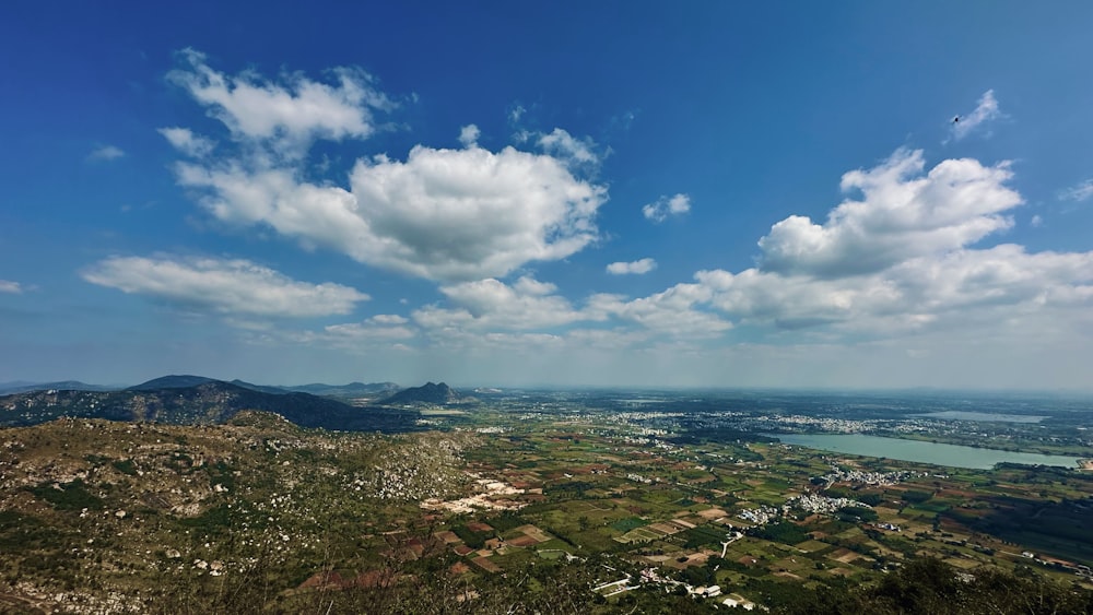 a scenic view of a city and a lake