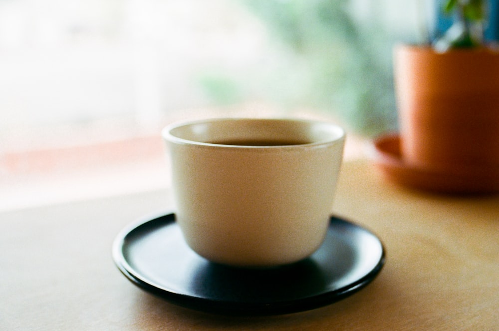 a cup of coffee sitting on top of a saucer