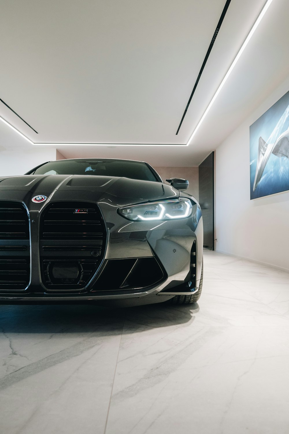 a black sports car parked inside of a building