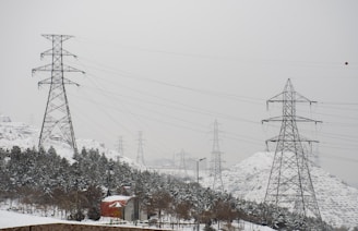Aerial view of transmission towers stretching over Ontario countryside.