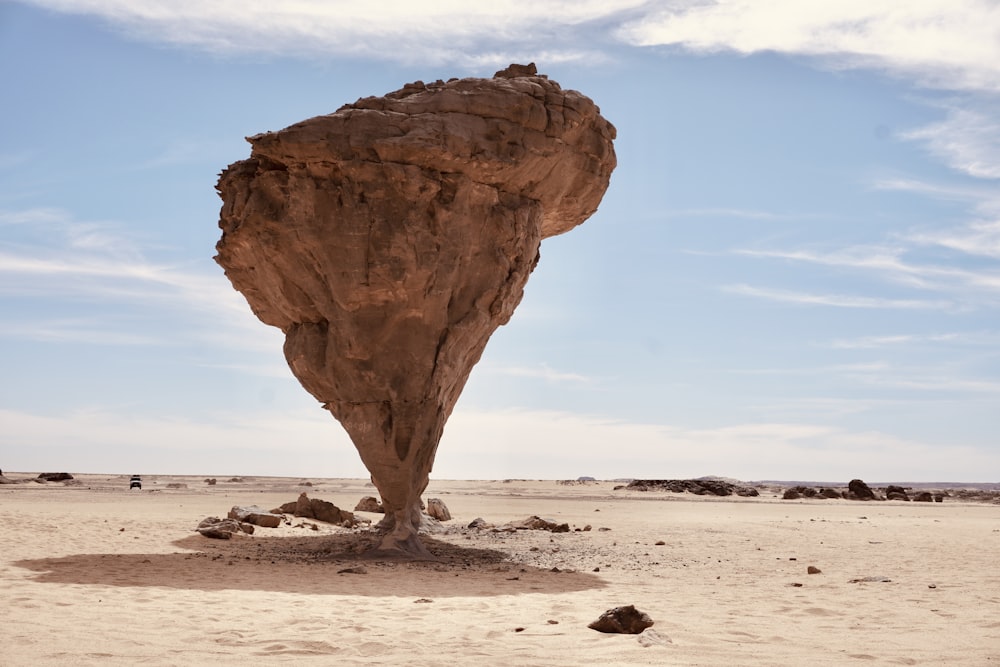 a rock formation in the middle of a desert