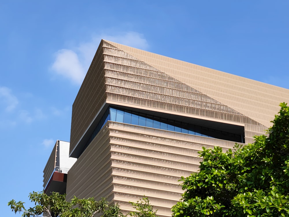 a tall building with a sky background