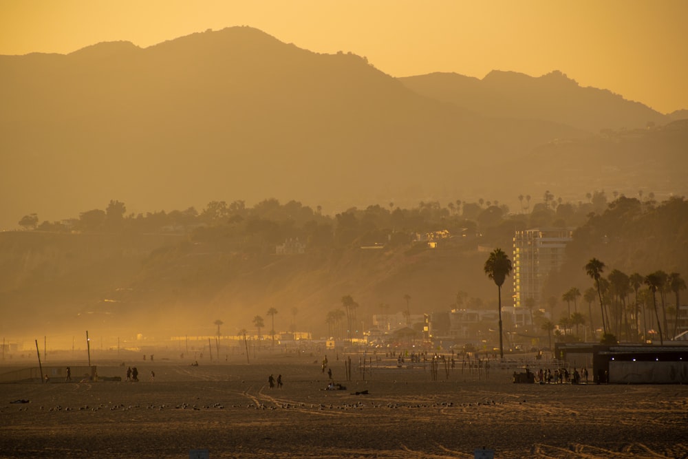 a view of a beach with mountains in the background