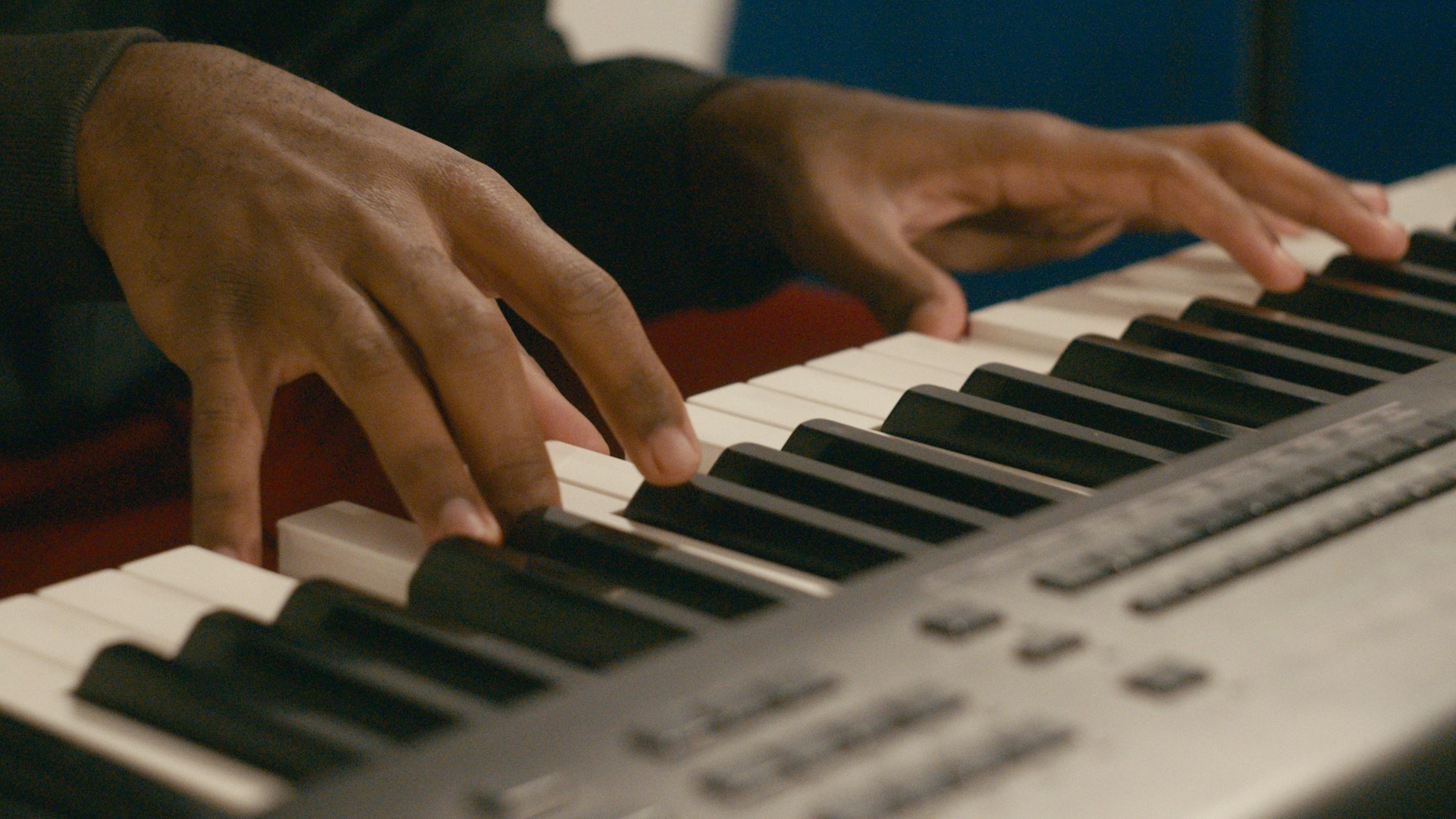 a close up of a person playing a piano