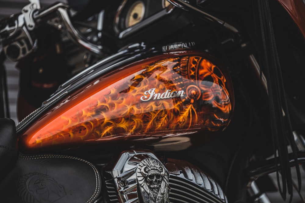 a close up of a motorcycle with flames on it