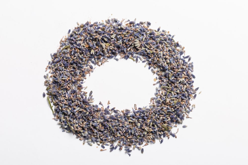 a circle of lavender sprinkles on a white background