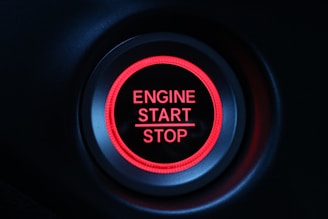 A bold, red call-to-action button labeled 'Get Started' glowing on a sleek digital interface.