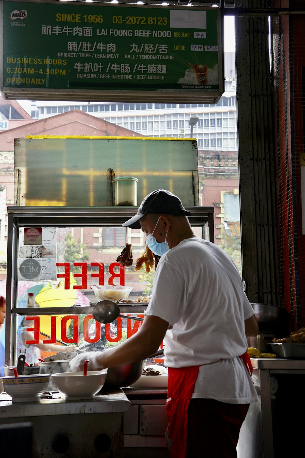 a man cooking food in a restaurant kitchen