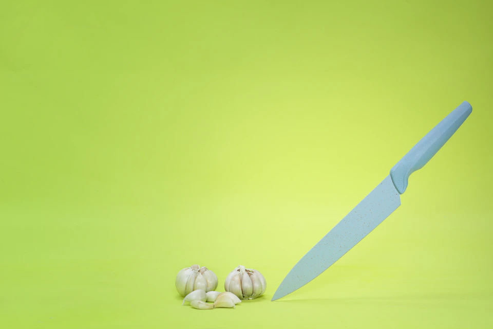 Stock photo: knife on green background (placeholder for The Emerald)