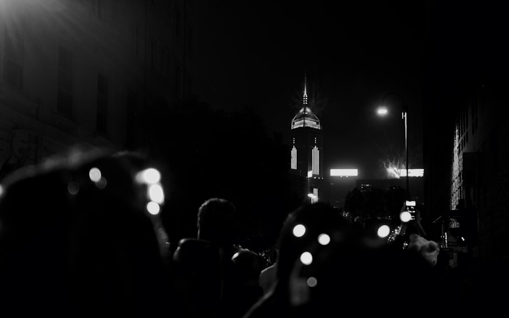 a black and white photo of a crowd of people