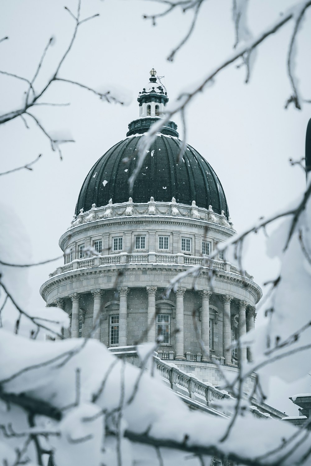 a dome on top of a building covered in snow