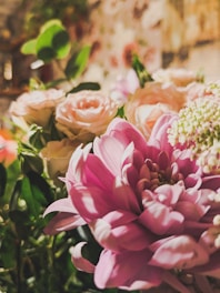 Close-up of a vibrant bouquet featuring soft greens and pastel pink blooms.