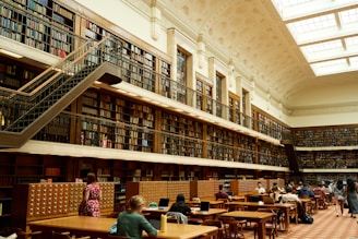 Grand library with high ceiling and numerous bookshelves, symbolizing the wealth of academicresource