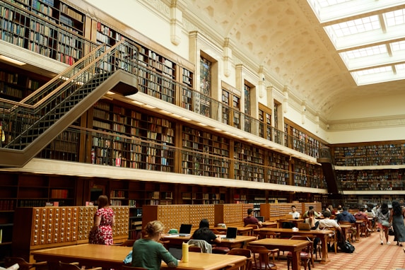 Grand library with high ceiling and numerous bookshelves, symbolizing the wealth of academicresource