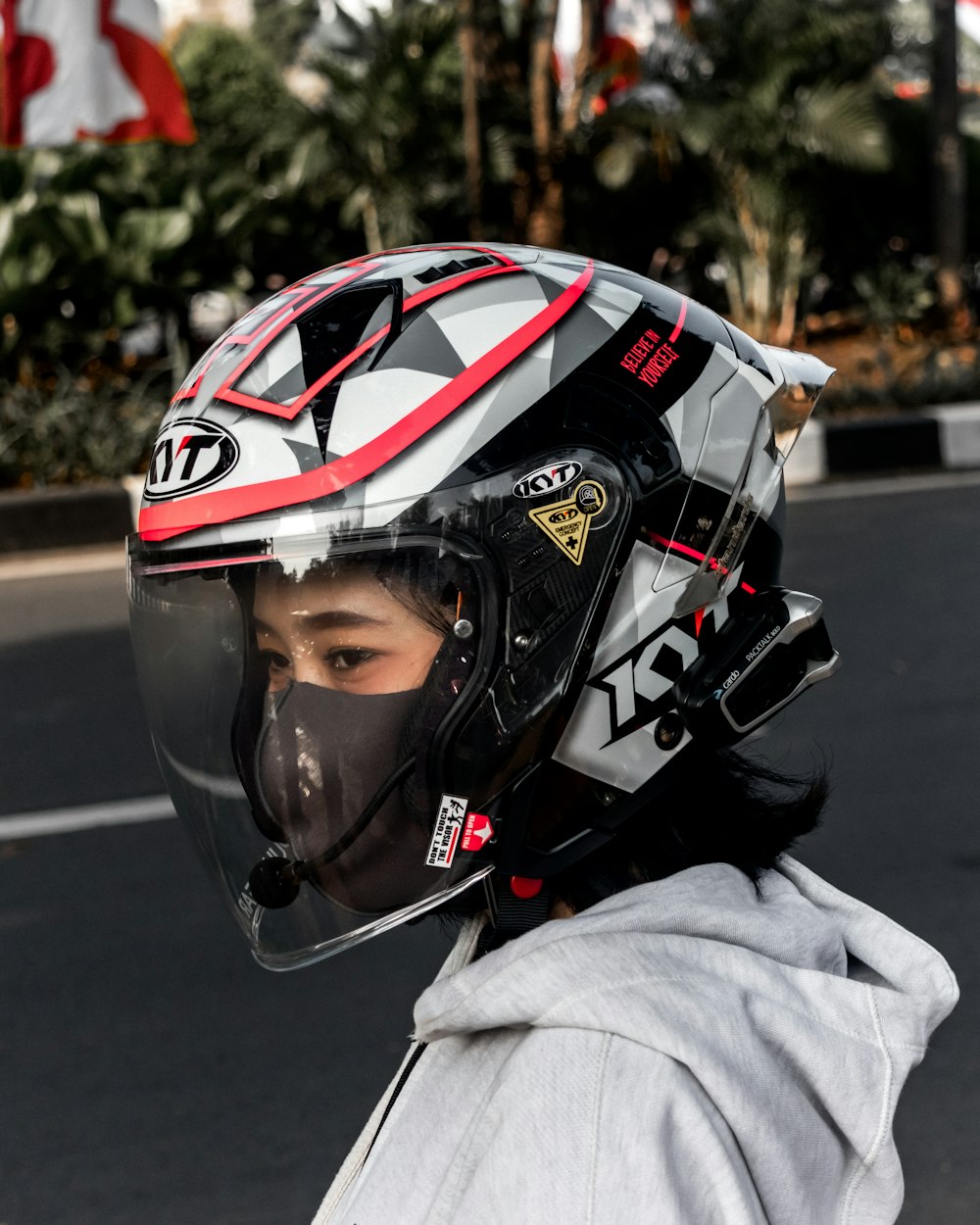 a person wearing a helmet on a city street