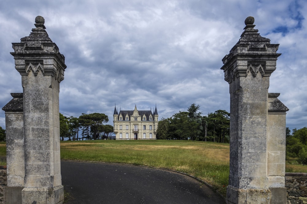 an old castle with two gates leading to it