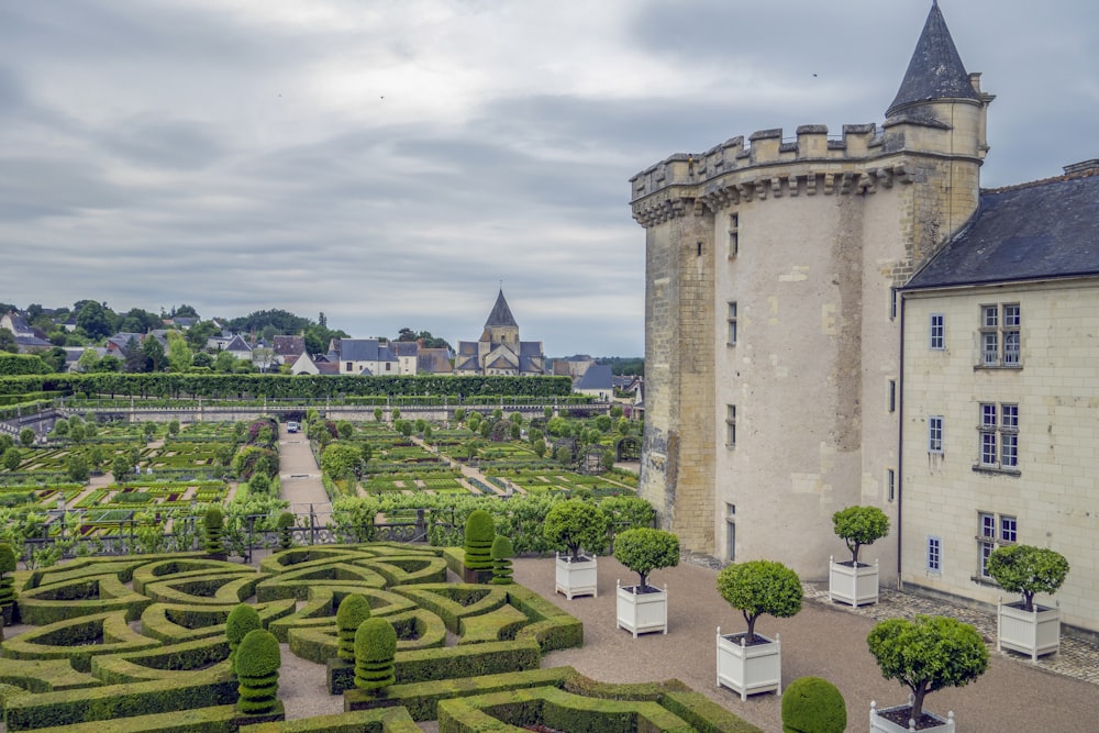 a castle with a garden in front of it