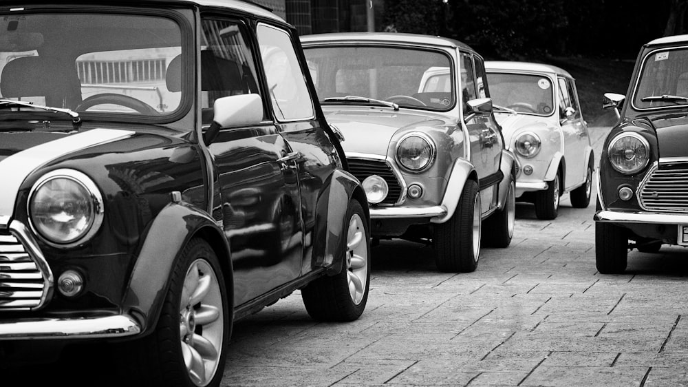 a row of mini cars parked next to each other