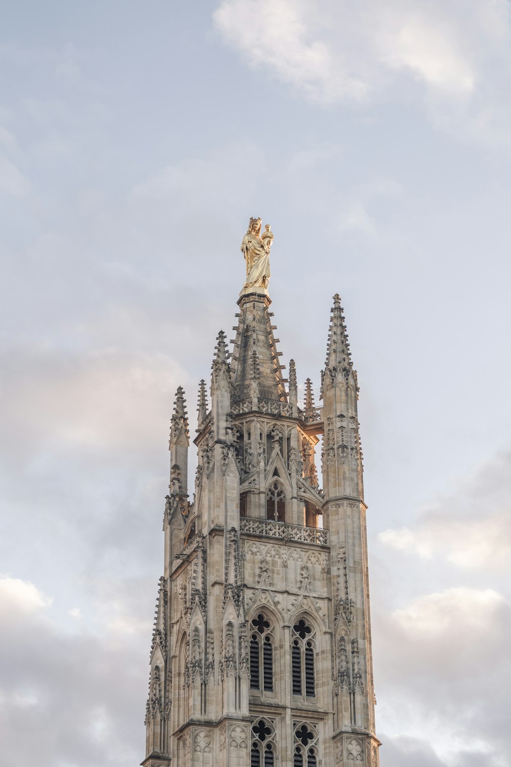 a very tall building with a statue on top of it