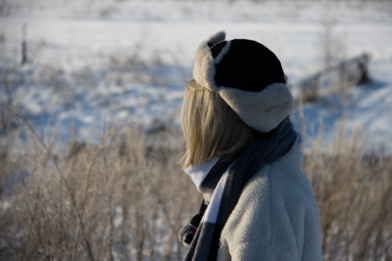 Stylish woman in winter hat and scarf