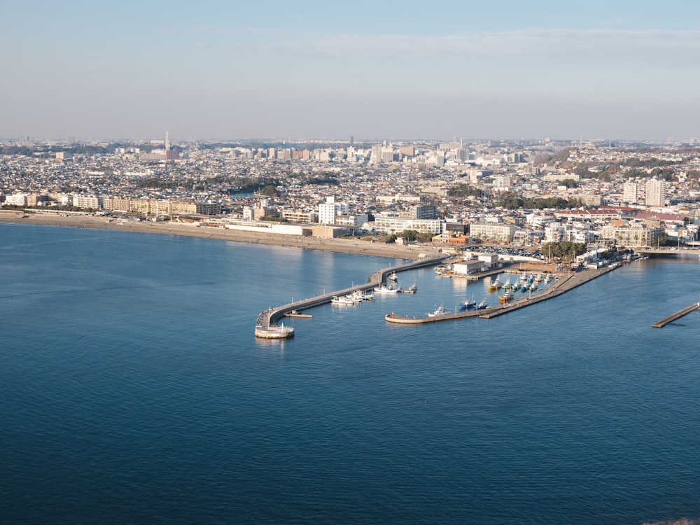 a large body of water with a city in the background