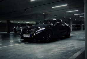 a couple of cars parked in a parking garage