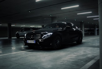 a couple of cars parked in a parking garage