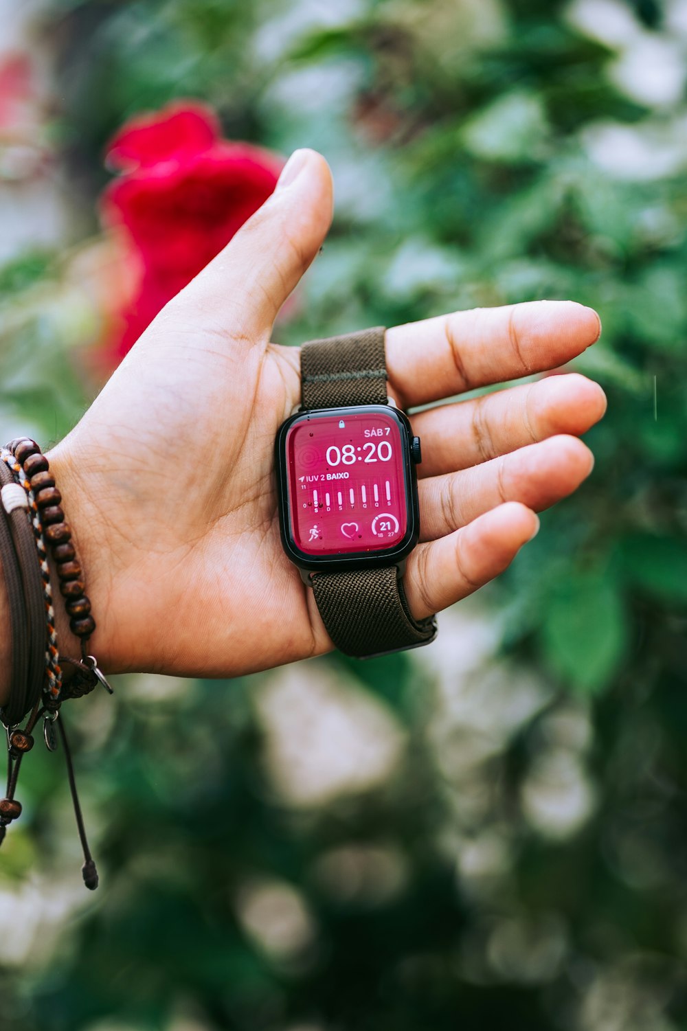 a person holding a smart watch in their hand