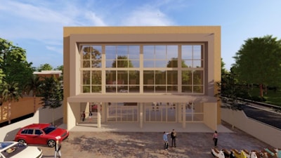 Exterior view of a modern office building with the Regdış Otomotiv sign visible at the entrance.