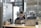 a woman sitting at a table with a laptop
