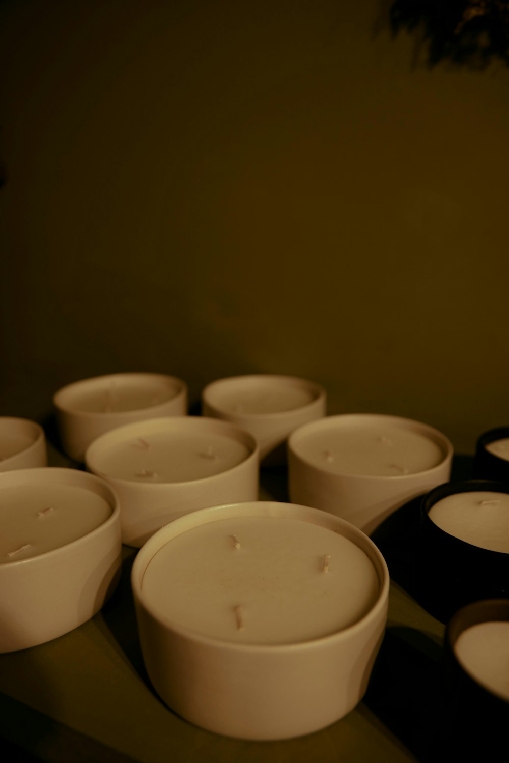 a group of white bowls sitting on top of a table