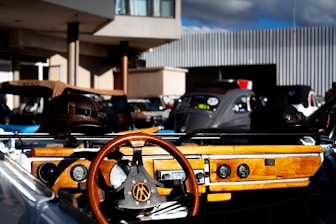 Various original car accessories displayed on a wooden table