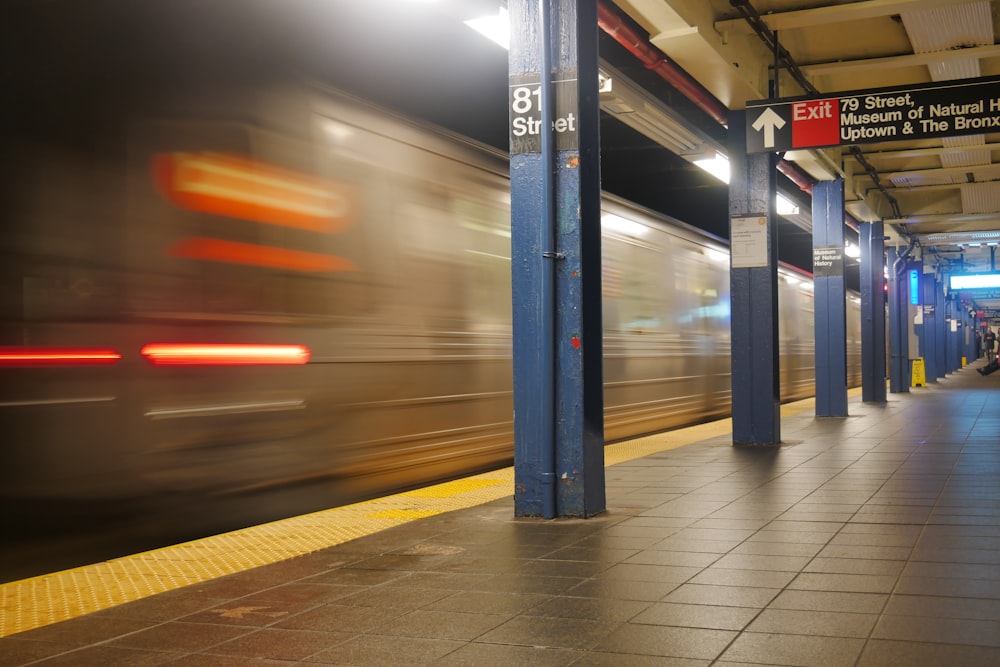 a blurry photo of a train coming in to a station