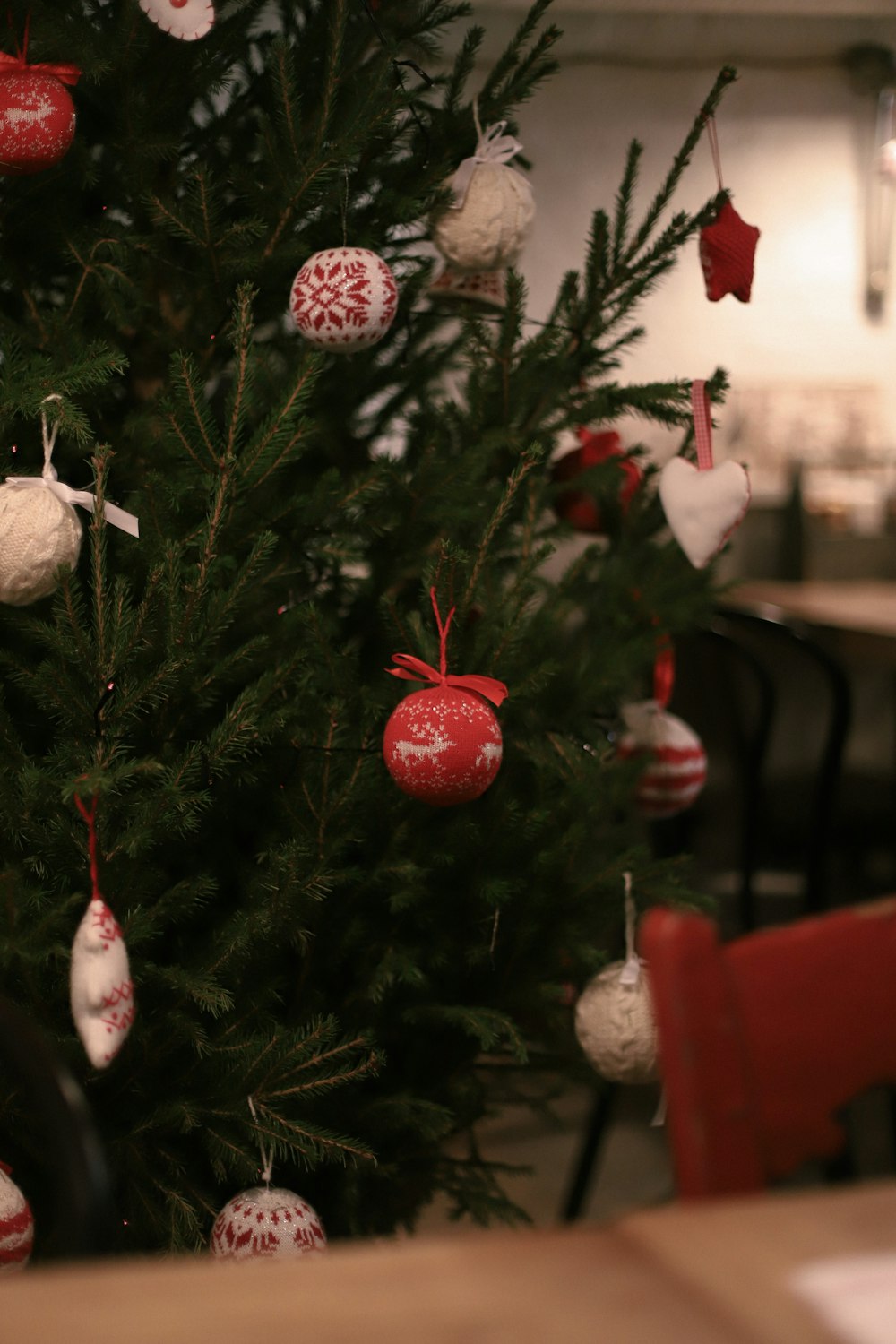 a christmas tree with red and white ornaments