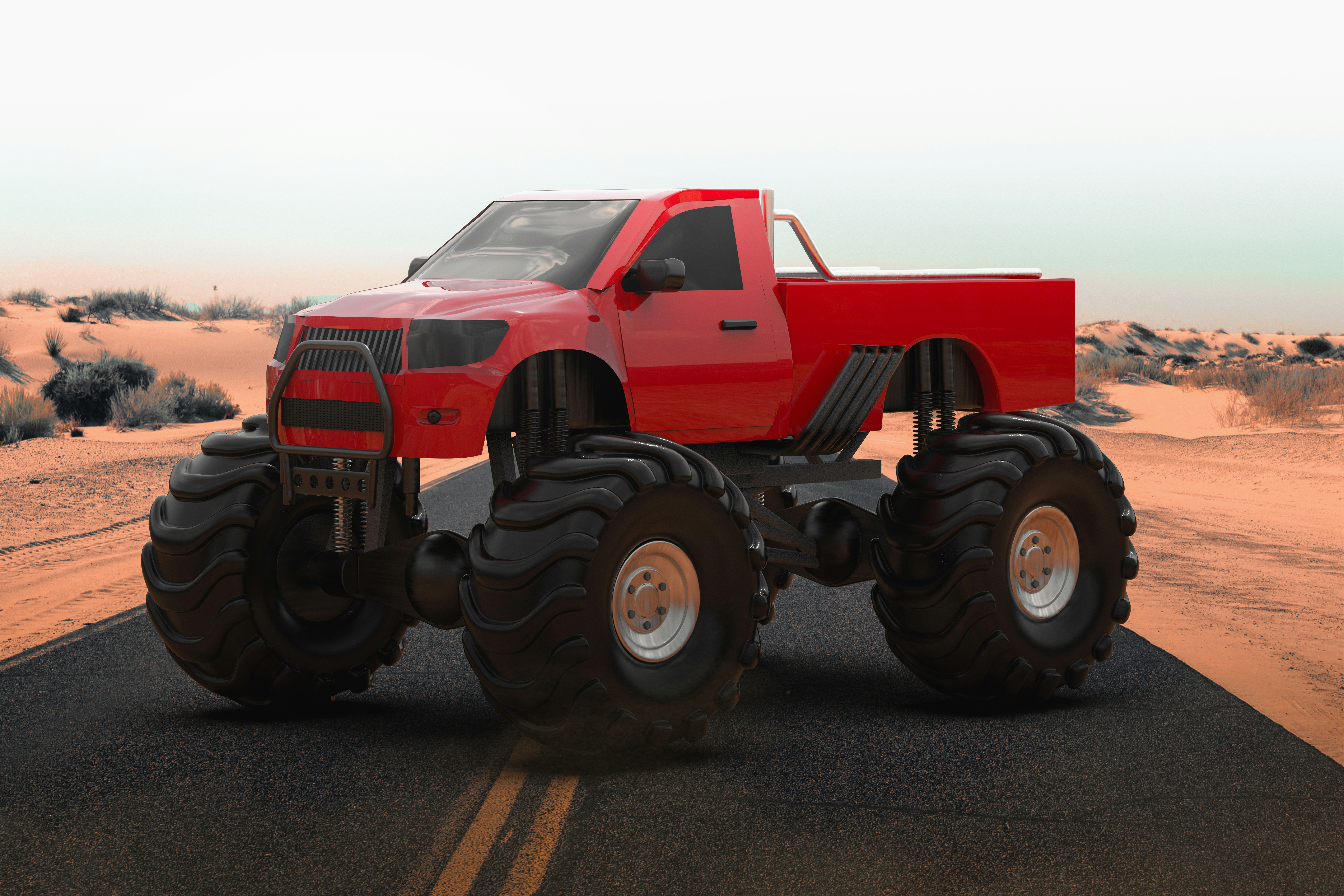 a red monster truck driving down a desert road