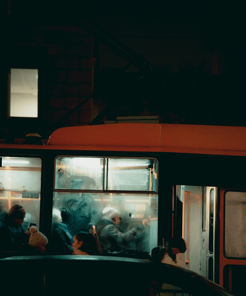 a group of people riding on the back of a bus