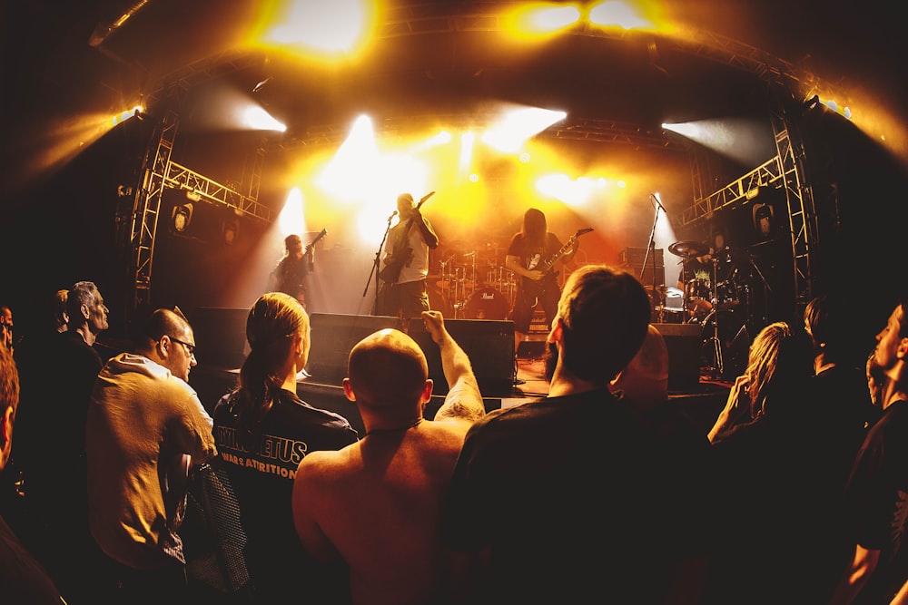 a group of people standing on top of a stage