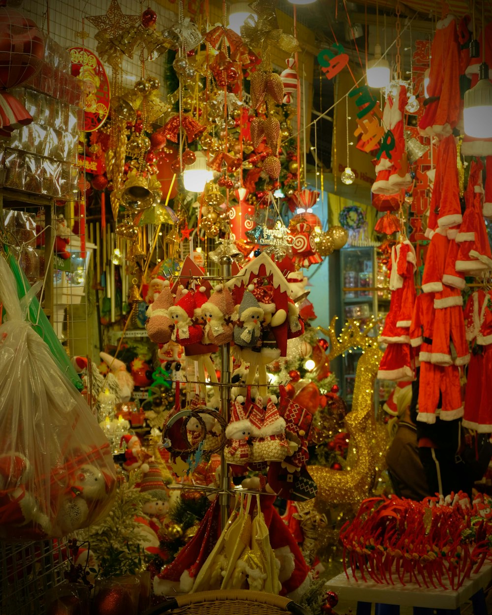 a christmas display in a store filled with lots of holiday decorations