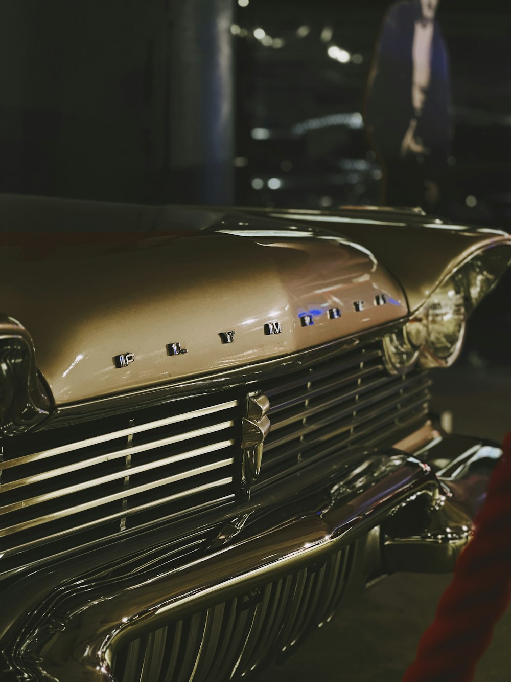 a close up of the front end of a classic car