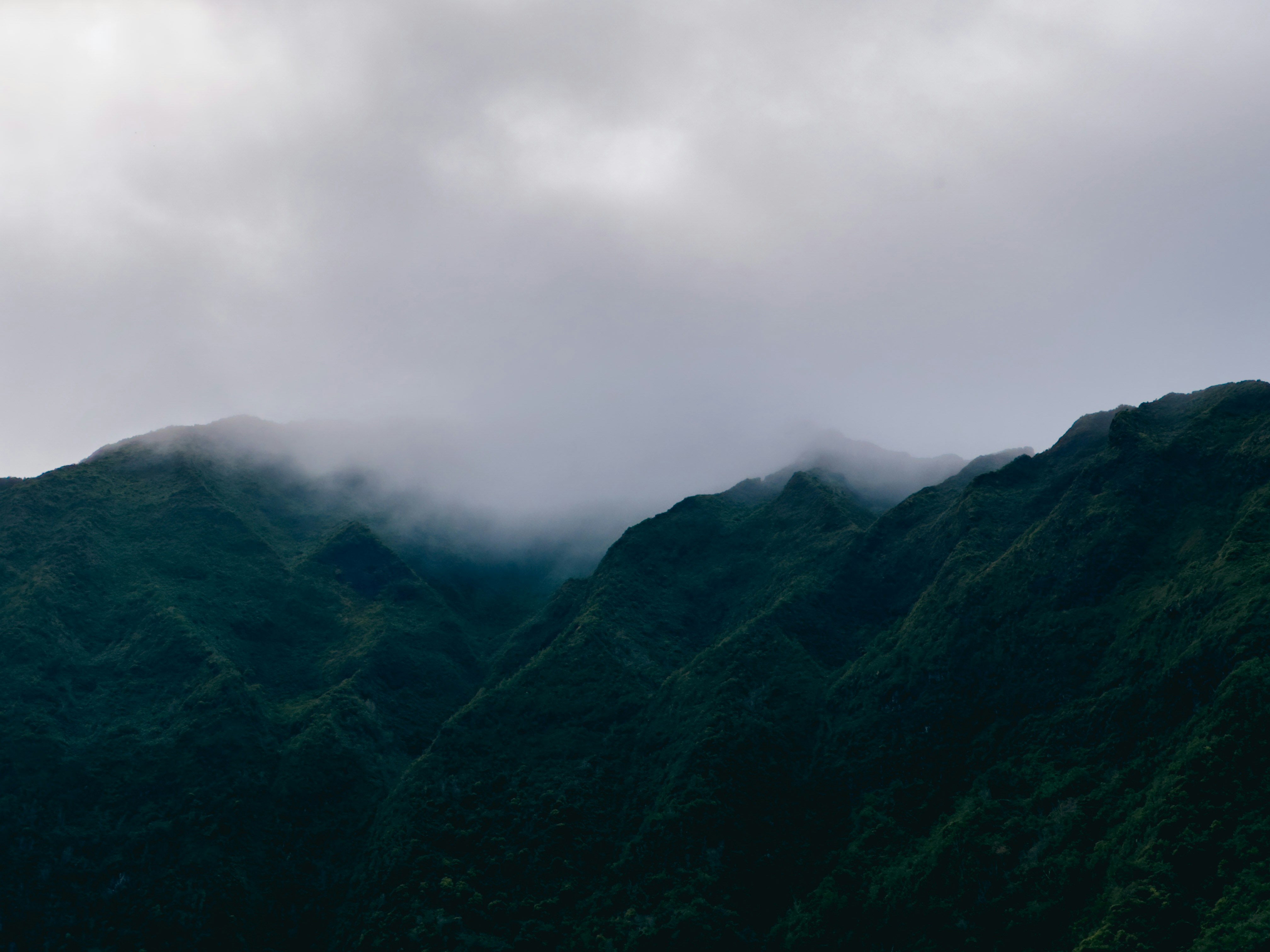 a view of a mountain range with low clouds, Konahuanui, Hawaii