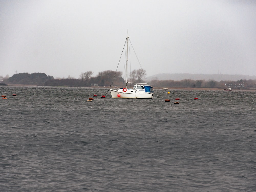 a boat floating on top of a large body of water