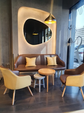 Comfortable seating area in a room with tasteful yellow gold and black accents.