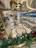 Elegant corporate holiday event featuring Santa Brent engaging warmly with guests in a luxurious lodge setting.
